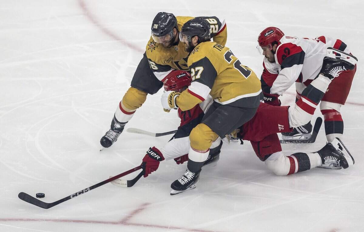 Carolina Hurricanes left wing Taylor Hall (71) is tripped by Vegas defenseman Shea Theodore (27) in the first period of Game 4 of the Stanley Cup Final, on Tuesday, June 9, 2026 in Las Vegas, NV.