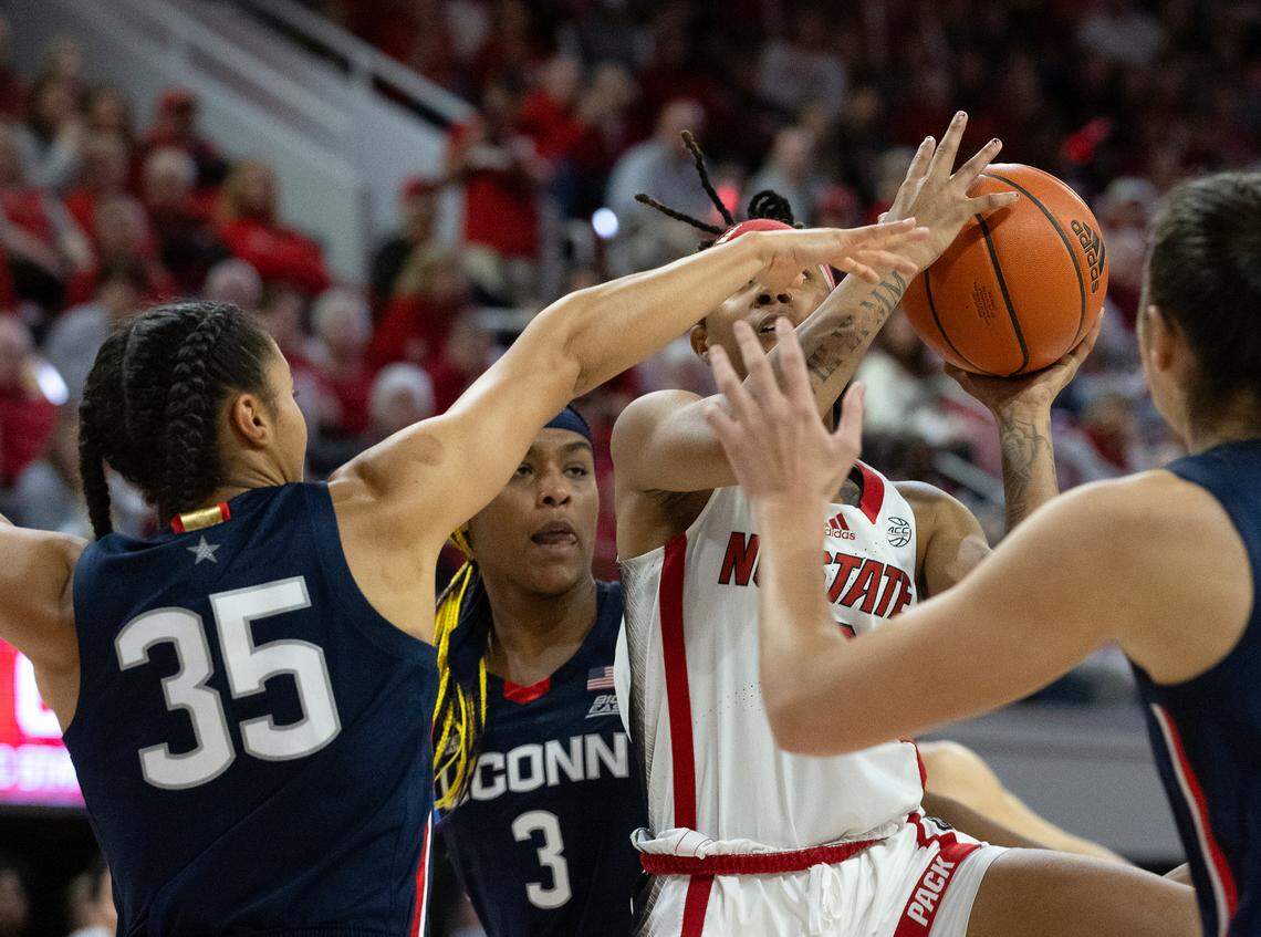 N.C. State’s Aziaha James drives through the UConn defense during the first half of the Wolfpack’s 92-81 win on Sunday, Nov. 12, 2023, at Reynolds Coliseum in Raleigh, N.C.