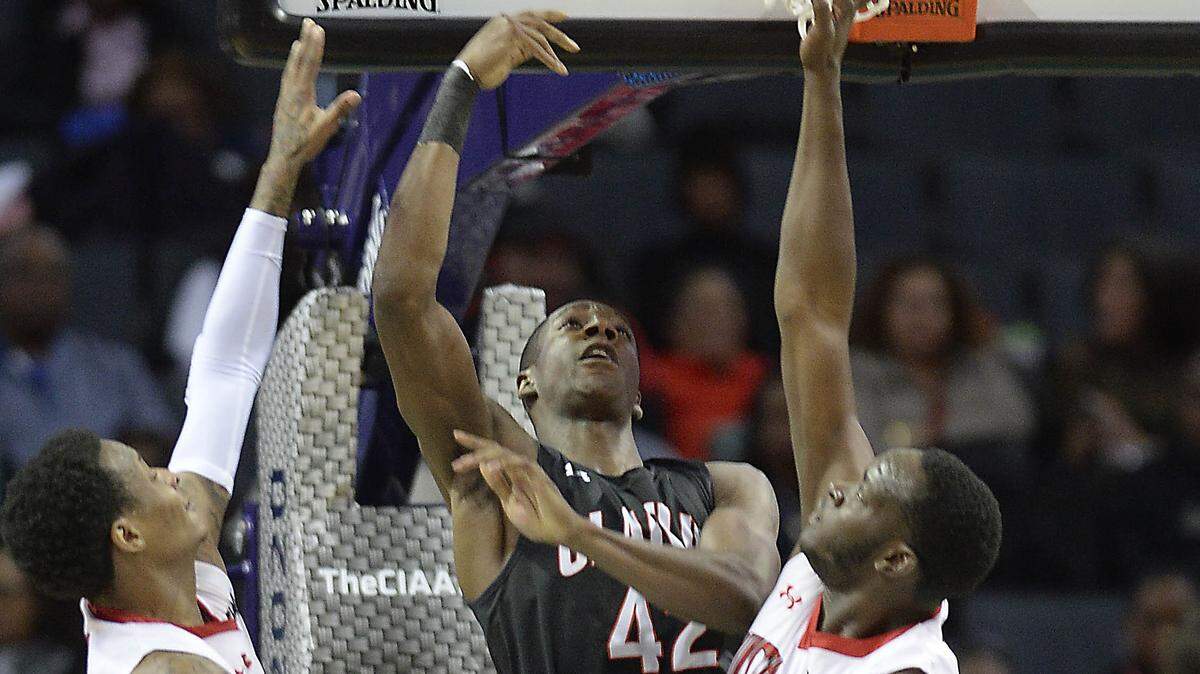 Winston-Salem State’s Justice Kithcart (0) and Melvin Huntley, Jr (33) defend Claflin’s Haneef Britt (42) during the first half of their semi-final game in the 2020 CIAA Tournament at the Spectrum Center on Friday, February 28, 2020.