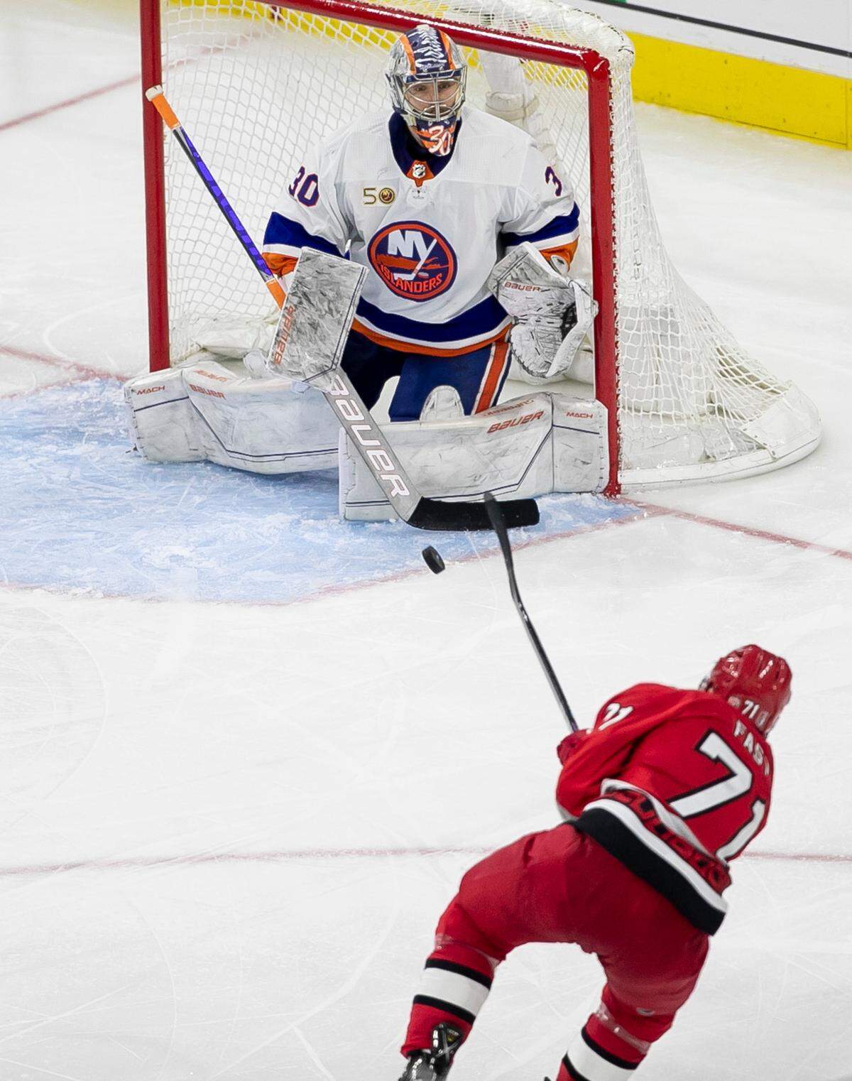 Carolina Hurricanes’ Jesper Fast (71) fires the game winning shot at New York Islander goalie Ilya Sorokin (30) to secure a 4-3 victory in overtime during game two of their Stanley Cup series on Wednesday, April 19, 2023 at PNC Arena in Raleigh, N.C.