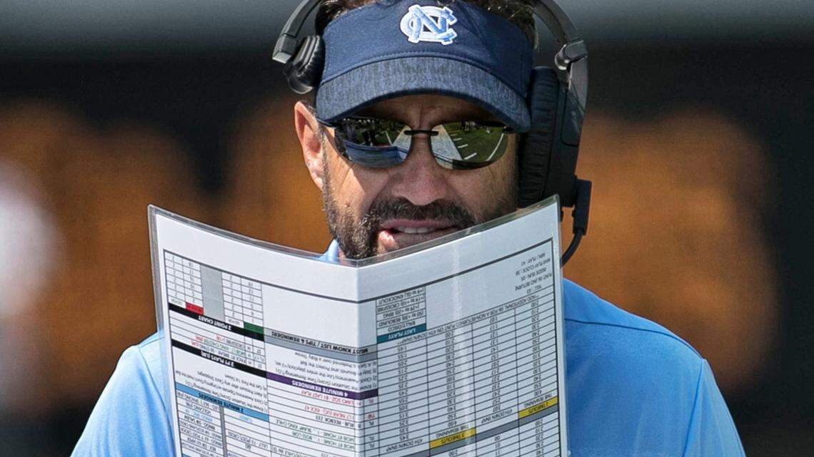 North Carolina coach Larry Fedora studies his play chart during the second quarter against California on Saturday, Sept. 1, 2018, in Berkeley, Ca.