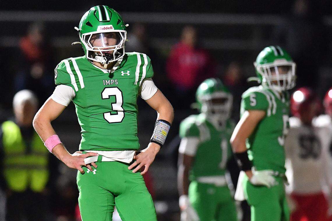 Cary's Nick Grena (3) and Erich Grena (5) look to the sidelines for direction against Middle Creek during the first half. The Cary Imps and the Middle Creek Mustangs met in a conference football game in Cary, N.C. on October 24, 2025