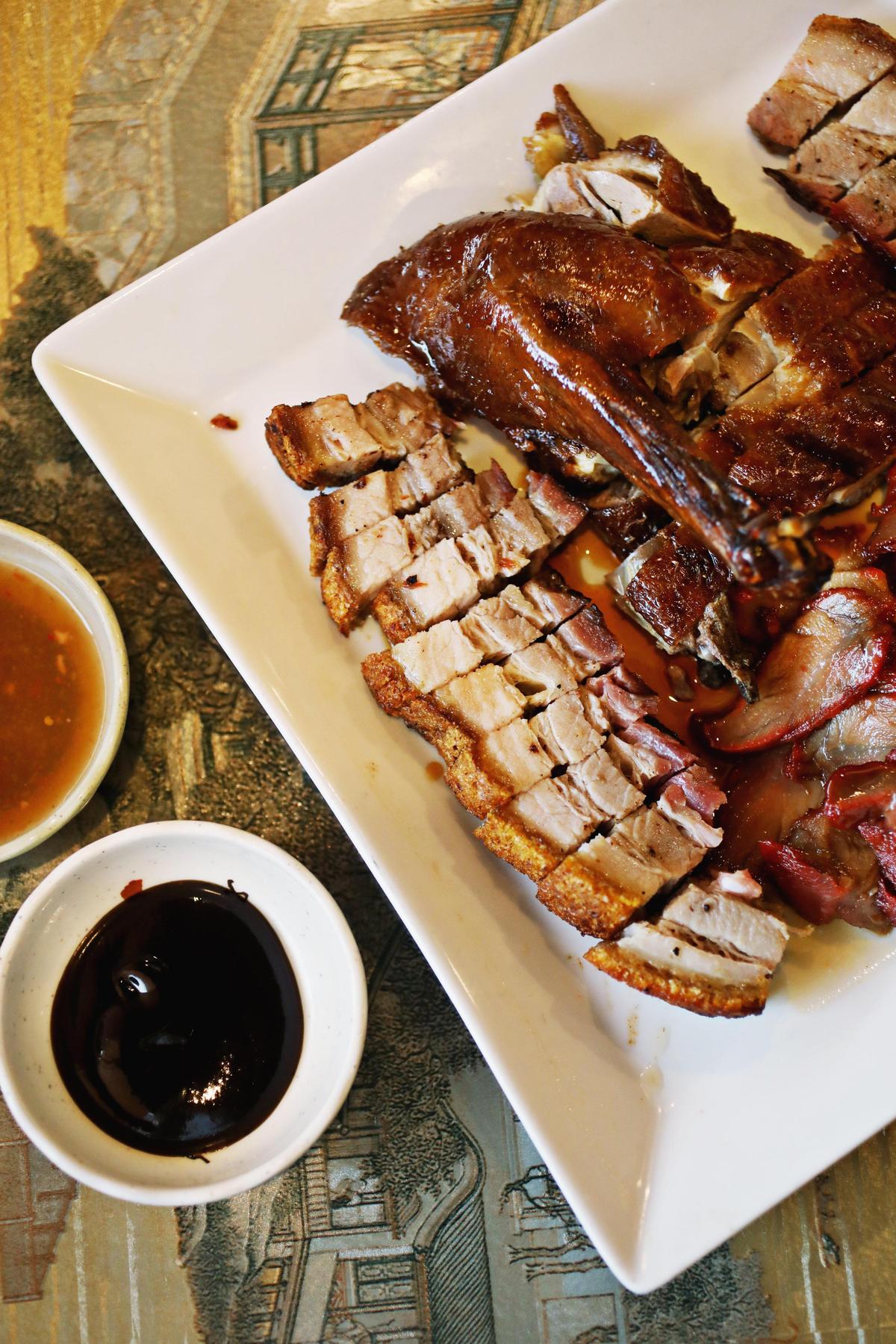 Yi Ge Asian Cuisine in Clayton serves a three-item BBQ sampler that is a carnivore’s bonanza of roast duck, roast pork and crispy pork belly, served in ample portion for four to share.