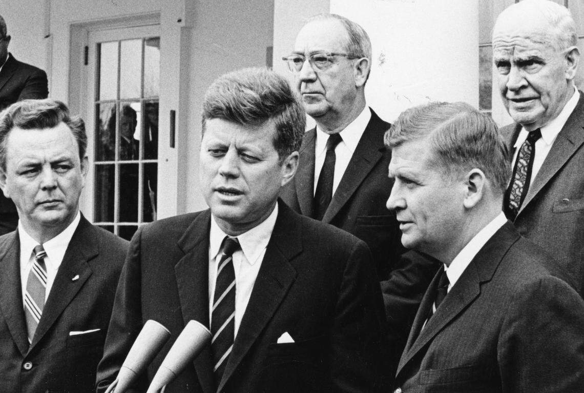 President John F. Kennedy (center) and NC Gov. Terry Sanford (front, right) at a meeting at the White House April 28, 1961. From left: Skipper Bowles, President Kennedy, Governor Sanford. At rear from left are Senator Everett Jordan and Commerce Secretary Luther Hodges.