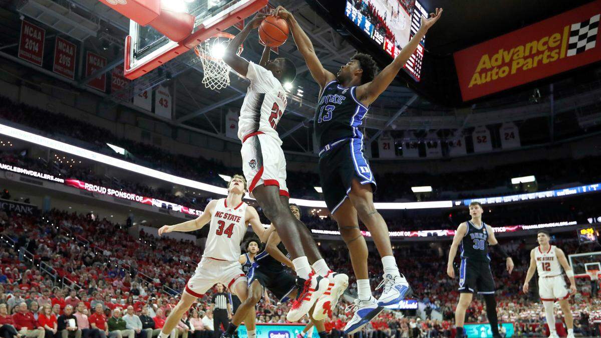 Duke’s Sean Stewart (13) blocks the shot by N.C. State’s Mohamed Diarra (23) during Duke’s 79-64 victory over N.C. State at PNC Arena in Raleigh, N.C., Monday, March 4, 2024.