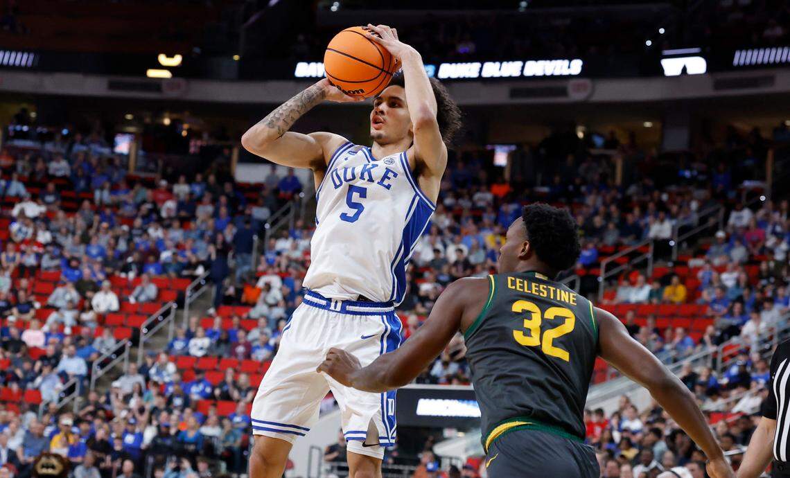 Duke’s Tyrese Proctor (5) hits a three-pointer as Baylor’s Jalen Celestine (32) tries to defend during the second half of Duke’s 89-66 victory over Baylor in the second round of the 2025 NCAA men’s basketball championship at the Lenovo Center in Raleigh, N.C., Sunday, March 23, 2025.