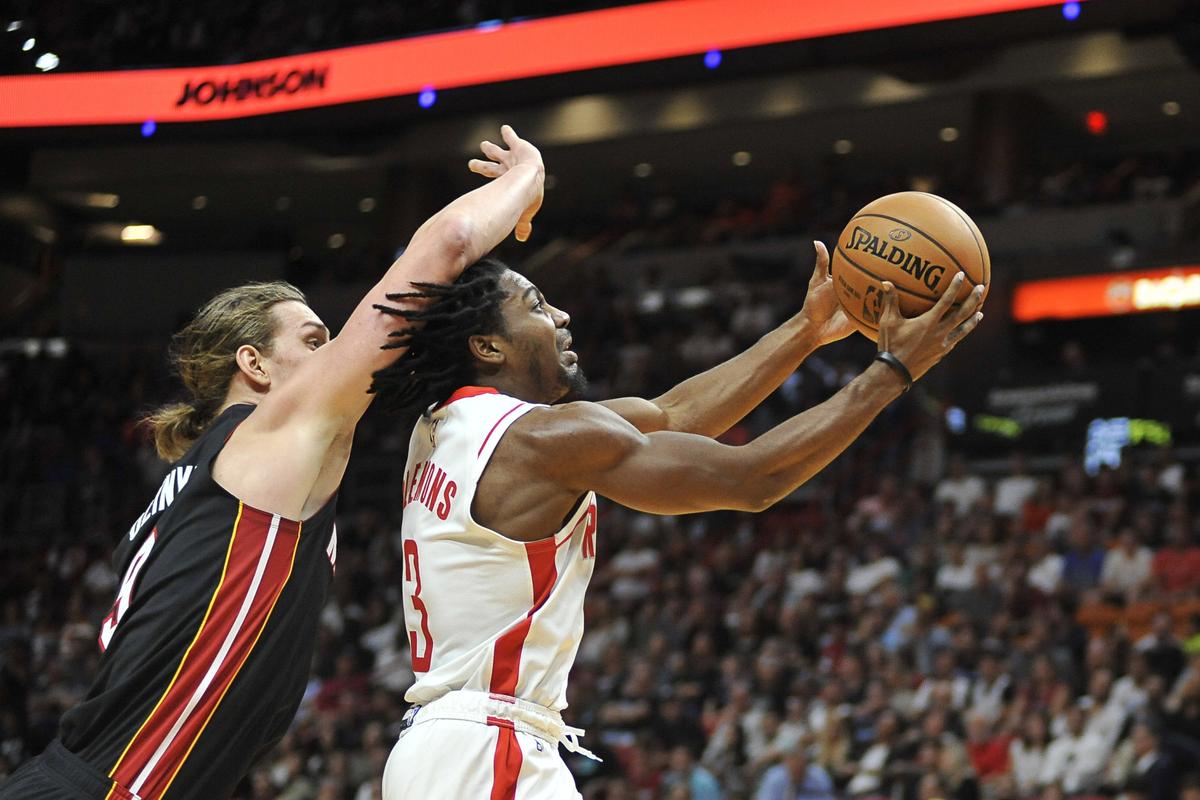 Houston Rockets guard Chris Clemons (3) goes up to shoot after getting past Miami Heat forward Kelly Olynyk (9) during the fourth quarter of an NBA basketball game, Sunday, Nov. 3, 2019, in Miami. (AP Photo/Gaston De Cardenas)