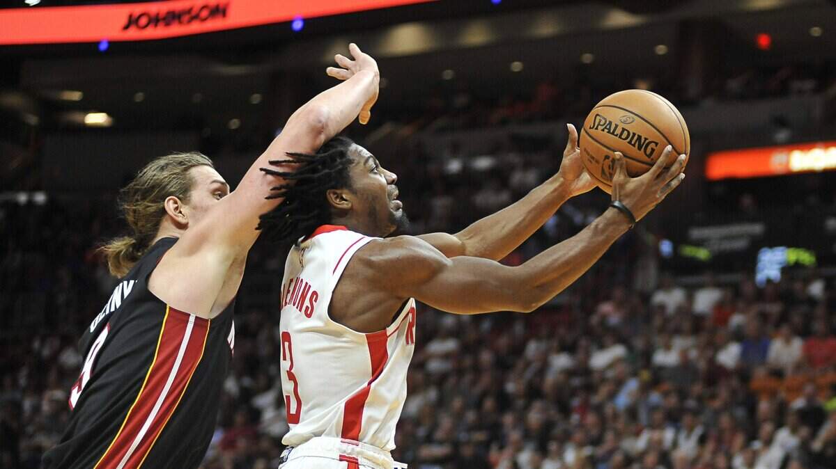 Houston Rockets guard Chris Clemons (3) goes up to shoot after getting past Miami Heat forward Kelly Olynyk (9) during the fourth quarter of an NBA basketball game, Sunday, Nov. 3, 2019, in Miami. (AP Photo/Gaston De Cardenas)