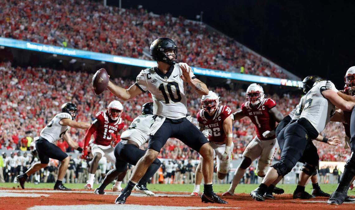 Wake Forest quarterback Sam Hartman (10) looks to pass during the second half of N.C. State’s 30-21 victory over Wake Forest at Carter-Finley Stadium in Raleigh, N.C., Saturday, Nov. 5, 2022.