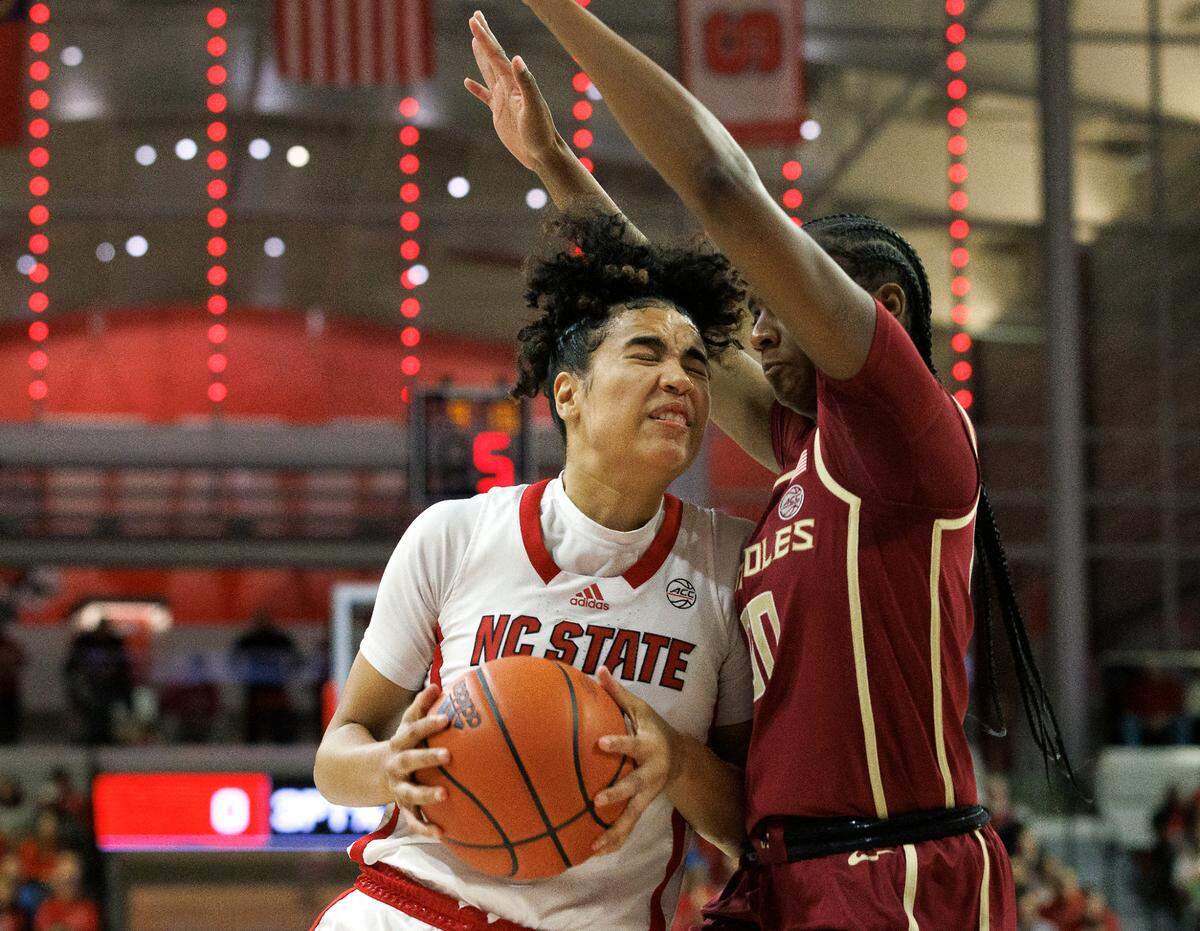 N.C. State’s Madison Hayes drives against Florida State’s Ta’Niya Latson during the first half of the Wolfpack’s game on Thursday, Jan. 4, 2023, at Reynolds Coliseum in Raleigh, N.C.