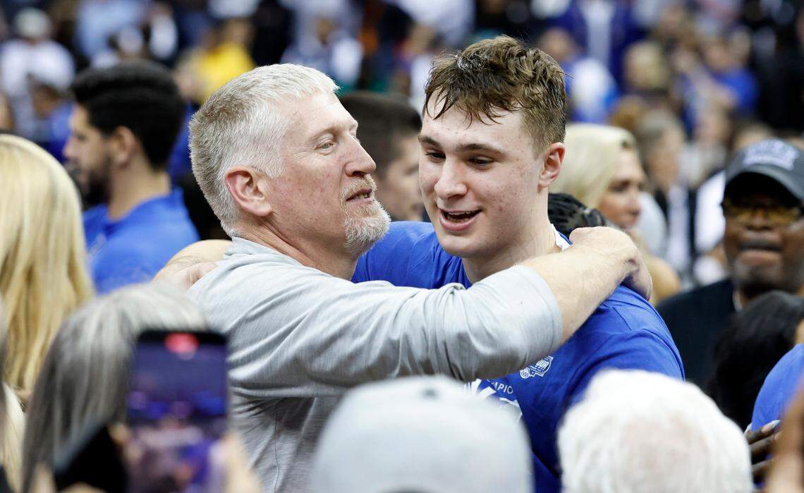 Ralph Flagg hugs his son, Cooper, after Duke’s 85-65 victory over Alabama in their Elite Eight game in the 2025 NCAA Men’s Basketball Championship at the Prudential Center in Newark, N.J., Saturday, March 29, 2025.