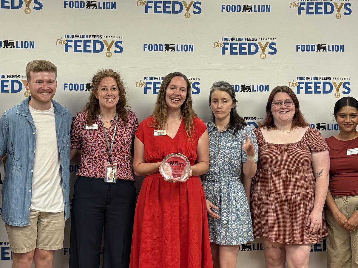 Alyssa Griffin, an NC State PhD student who manages the Feed the Pack food pantry, was surprised with a Lion Heart Volunteer Award from Food Lion on Thursday.