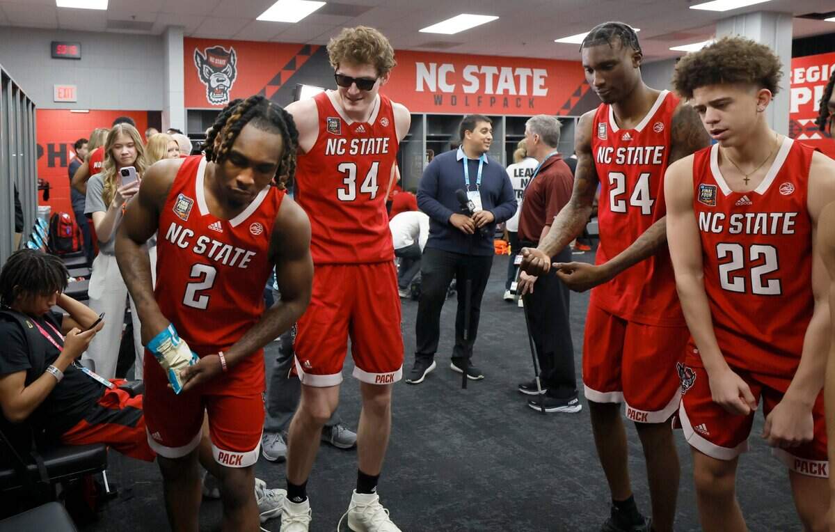 N.C. State’s Kam Woods (2), Ben Middlebrooks (34), Ernest Ross (24) and Jordan Snell (22) watch a video during an availability in the N.C. State locker room at State Farm Stadium in Glendale, Ariz. Thursday, April 4, 2024. The Wolfpack will face Purdue in the Final Four on Saturday.