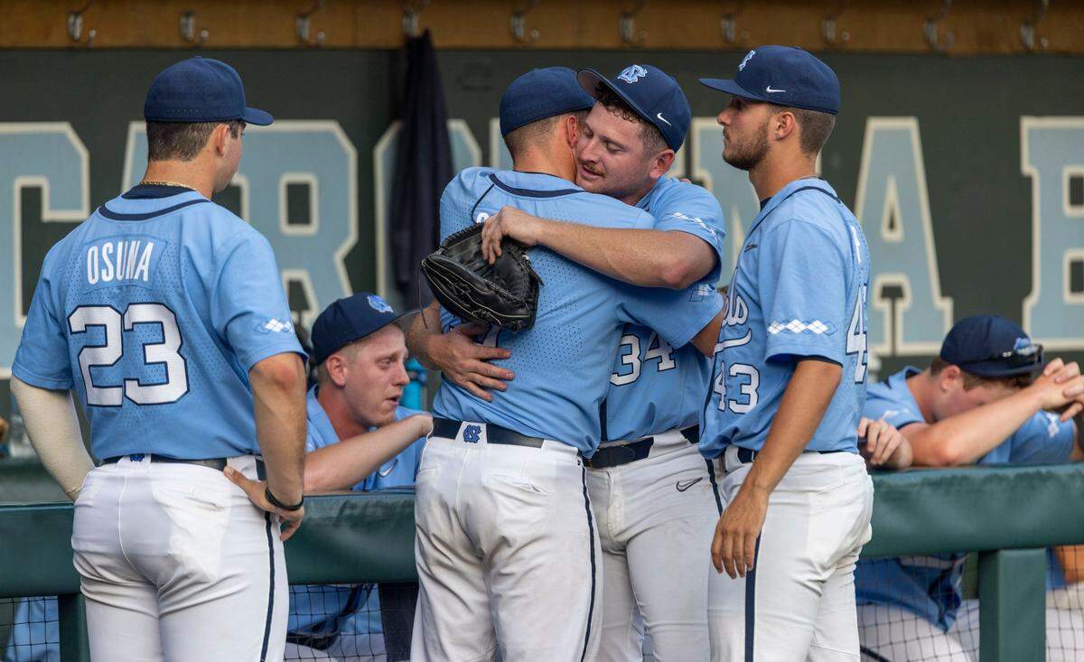 North Carolinas Eric Grintz (5) embraces closing pitcher Caden OBrien (34) following the Tar Heels 4-3 loss to Arkansas in the NCAA Super Regional series on Sunday, June 12, 2022 at Boshamer Stadium in Chapel Hill, N.C.