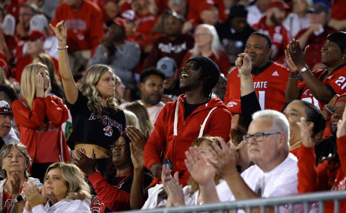 Fans cheer on the Wolfpack during the first half of N.C. State’s game against UConn at Rentschler Field in East Hartford, Conn. Thursday, August 31, 2023.