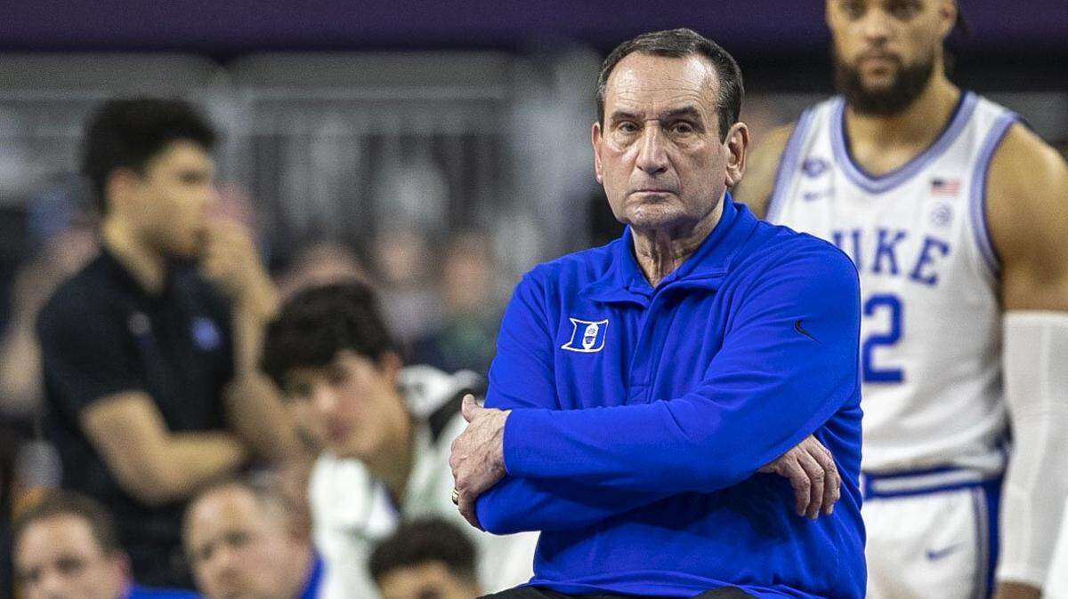 Duke coach Mike Krzyzewski crosses his arms as defeat sets in, as North Carolina’s Caleb Love (2) sinks his second free-throw to secure the Tar Heels’ 81-77 victory in the NCAA Final Four semi-final on Saturday, April 2, 2022 at Caesars Superdome in New Orleans, La.