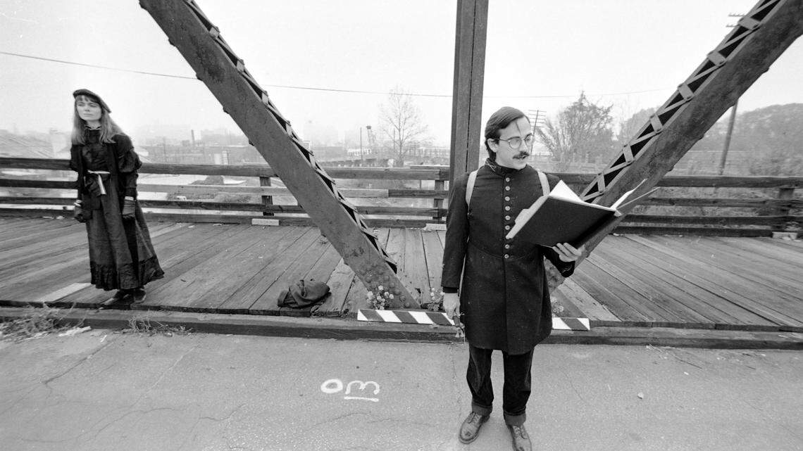 Karl Larson leading a mock funeral for the Boylan Street truss bridge before its demolition in 1981.