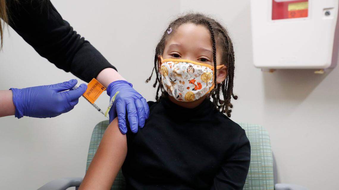 Heaven Gower, 10, of Wake Forest gets a pediatric COVID-19 vaccine shot, administered by Marti Arizona, RN, at UNC Childrens clinics in Raleigh, N.C., Thursday, Nov. 4, 2021.