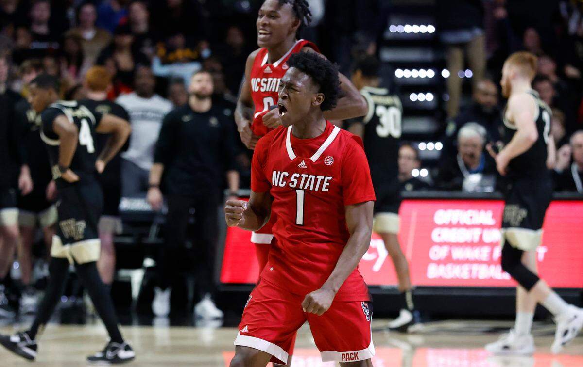 N.C. State’s Jarkel Joiner (1) and Terquavion Smith (0) celebrate after N.C. State’s 79-77 victory over Wake Forest at Joel Coliseum in Winston-Salem, N.C., Saturday, Jan. 28, 2023.