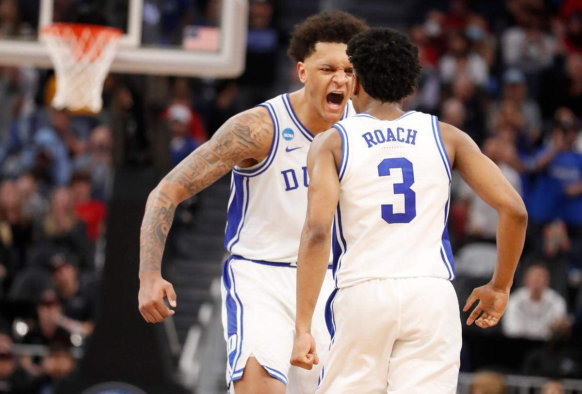 Duke’s Paolo Banchero (5) celebrates with Jeremy Roach (3) after Roach made a shot late in the second half of Duke’s 78-73 victory over Texas Tech in the Sweet 16 round of the NCAA Tournament at the Chase Center in San Francisco, Calif., Thursday, March 24, 2022.