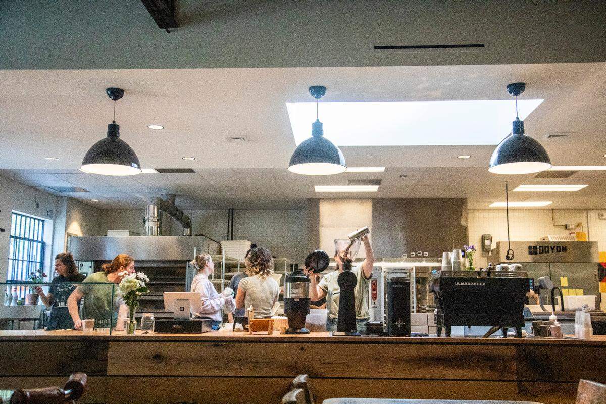 Workers prepare for the reopening of Boulted Bread at their new location on Dupont Circle in Raleigh on Friday, May 12, 2023.