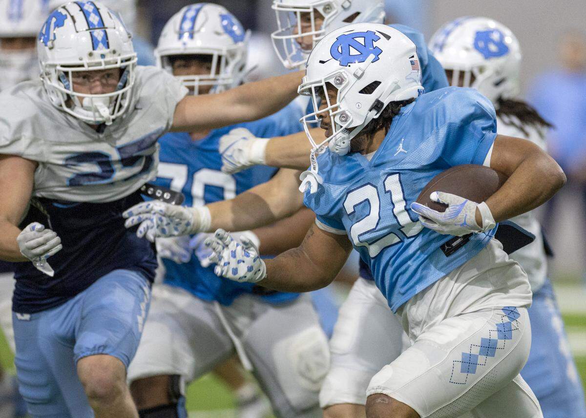 North Carolina running back Davion Cause (21) carries the ball during the Tar Heels’ scrimmage on Thursday, April 11, 2024 in Chapel Hill, N.C.