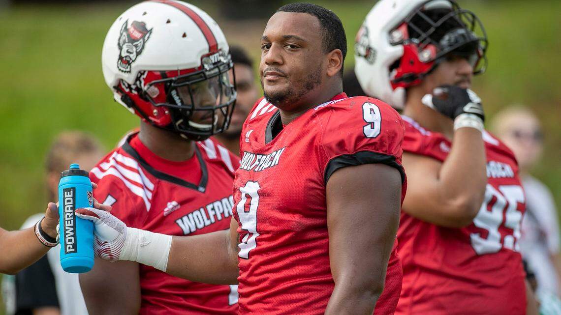 N.C. States defensive end Savion Jackson (9) takes a break during the Wolfpacks practice on Thursday, August 11, 2022 in Raleigh, N.C.