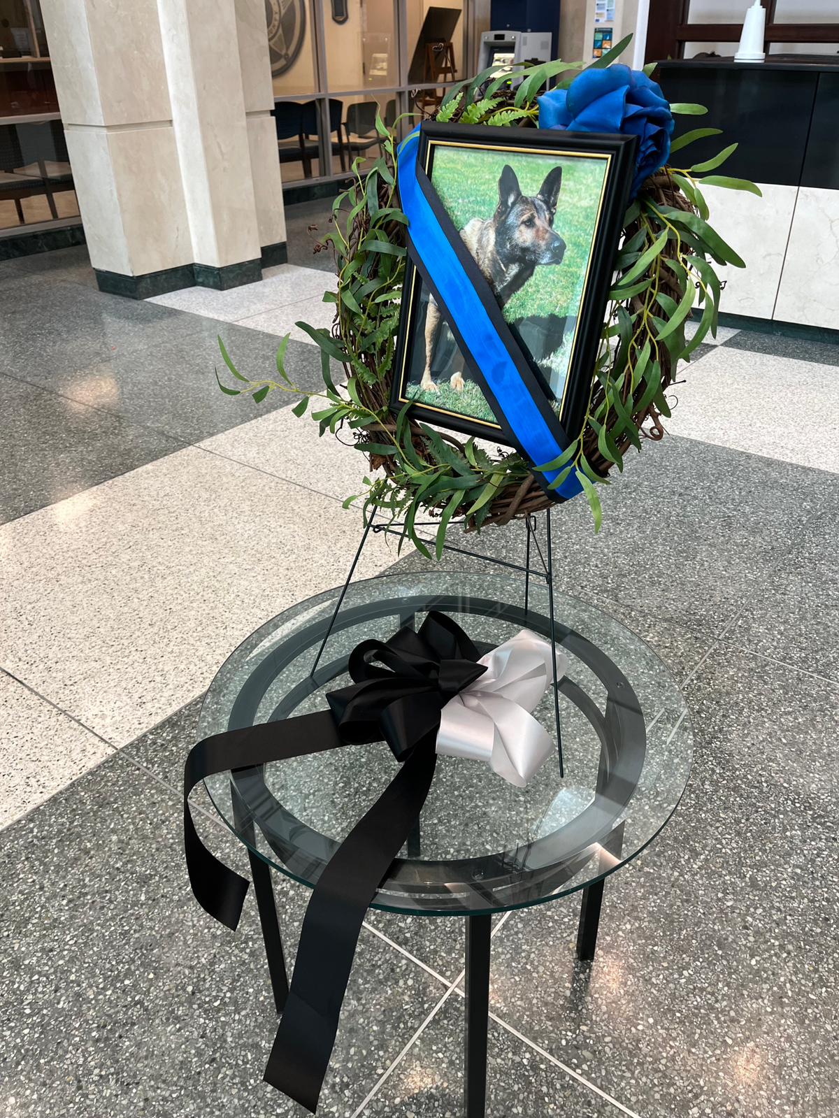 A memorial to Wake County K9 officer Santos, a German shepherd, is on display in front of the Public Safety Center on Salisbury Street in downtown Raleigh.