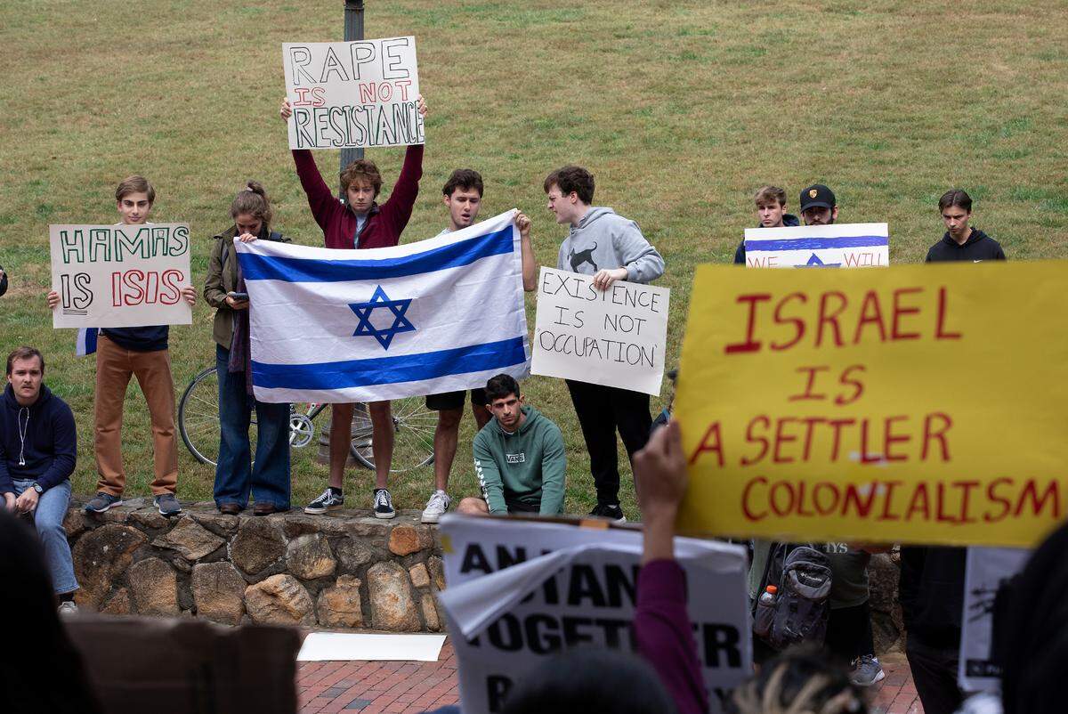 Counter-protesters and pro-Palestinian demonstrators gather during a rally in support of Palestinians at UNC-Chapel Hill on Thursday, Oct. 12, 2023.