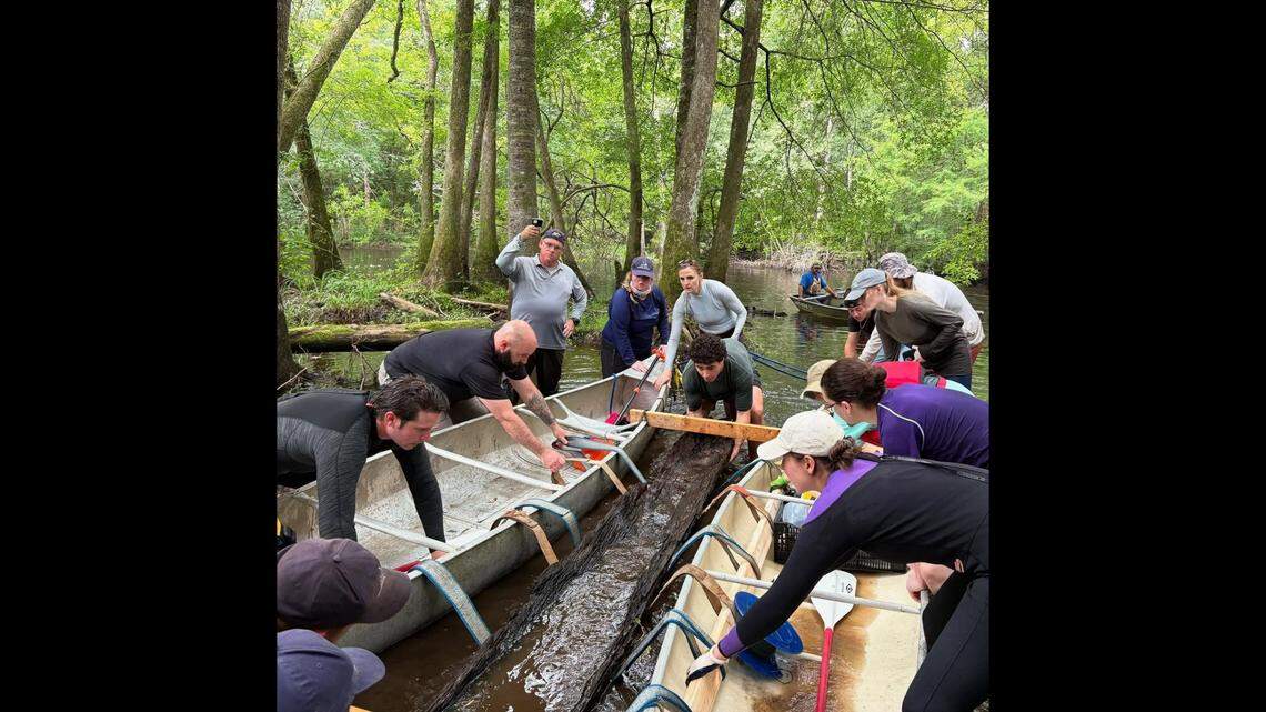 The recovery involved experts from multiple branches of state government and the Coharie Tribe, who worked together to lift the canoe out of the water with straps to tow it to a waiting truck, officials said. It is being kept wet in “a secure pond for safe keeping,” officials said.