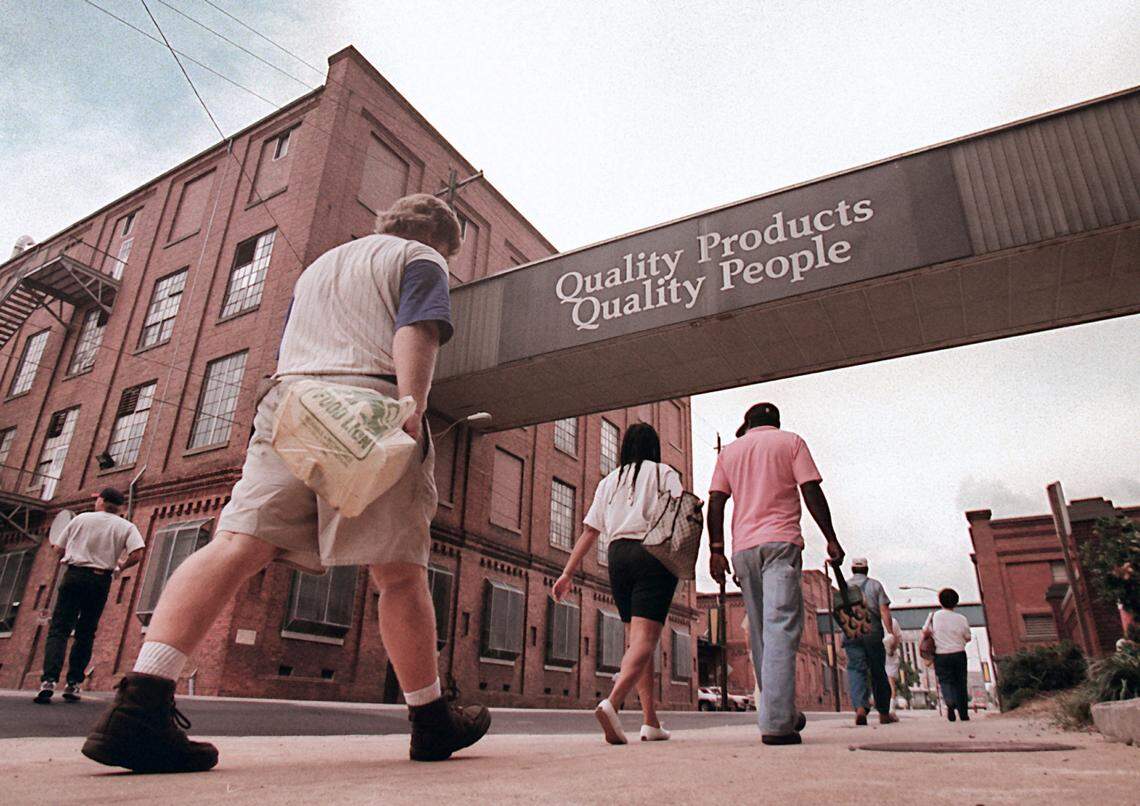 Employees leaves the Main Street building of Liggett & Myers in Durham at the end of their shift in 1996.