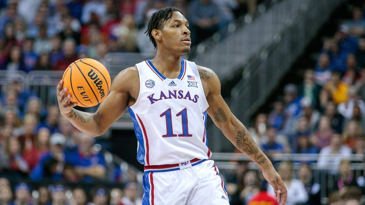 Kansas Jayhawks guard MJ Rice (11) sets the play during their game against the Texas Longhorns at the Big 12 Conference Tournament Championship in March 2023.