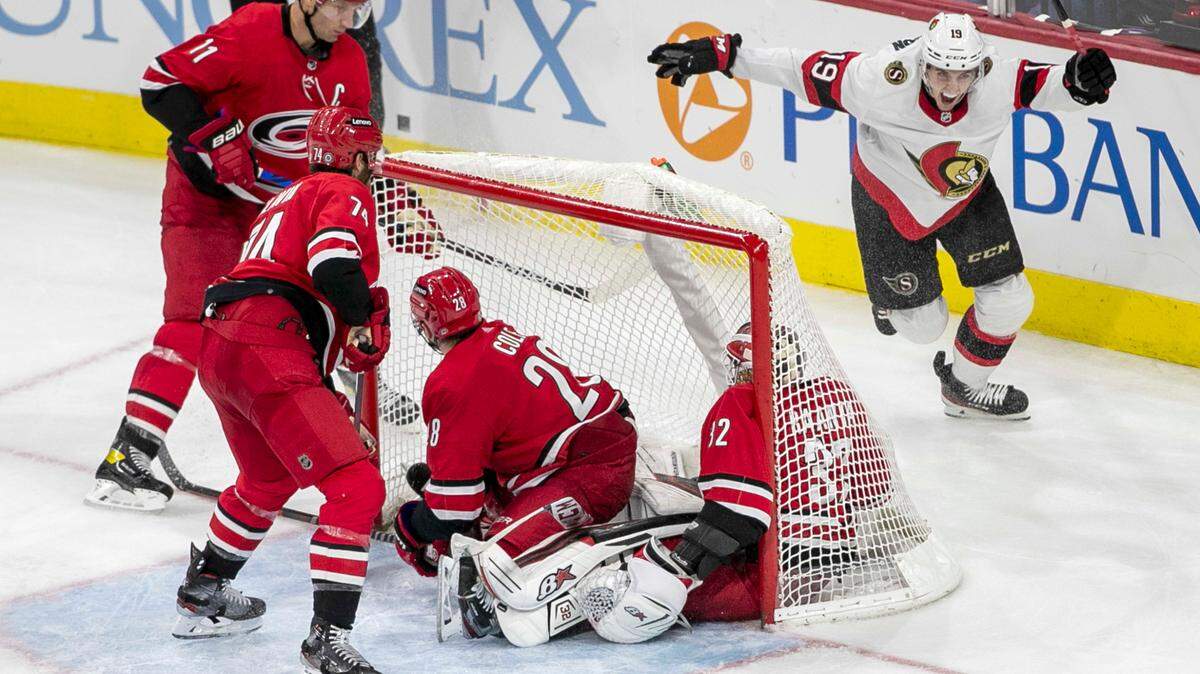 Ottawa’s Drake Batherson (19) reacts after a goal by teammate Josh Norris in the third period to give the Senators’ a 3-2 victory over the Carolina Hurricanes on Thursday, December 2, 2021 at PNC Arena in Raleigh, N.C.