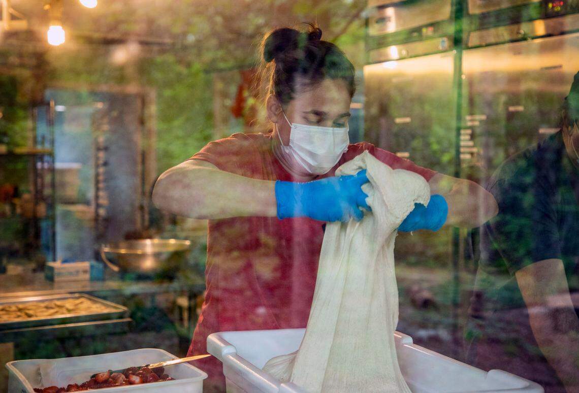 Julia Blaine prepares dough for baking loaves that will be delivered to customers’ porches by Strong Arm Baking, co-owned with her husband Thomas Blaine, as they work to change their business model to adapt to COVID-19, on Thursday, Apr. 23, 2020, in Franklinton, N.C.