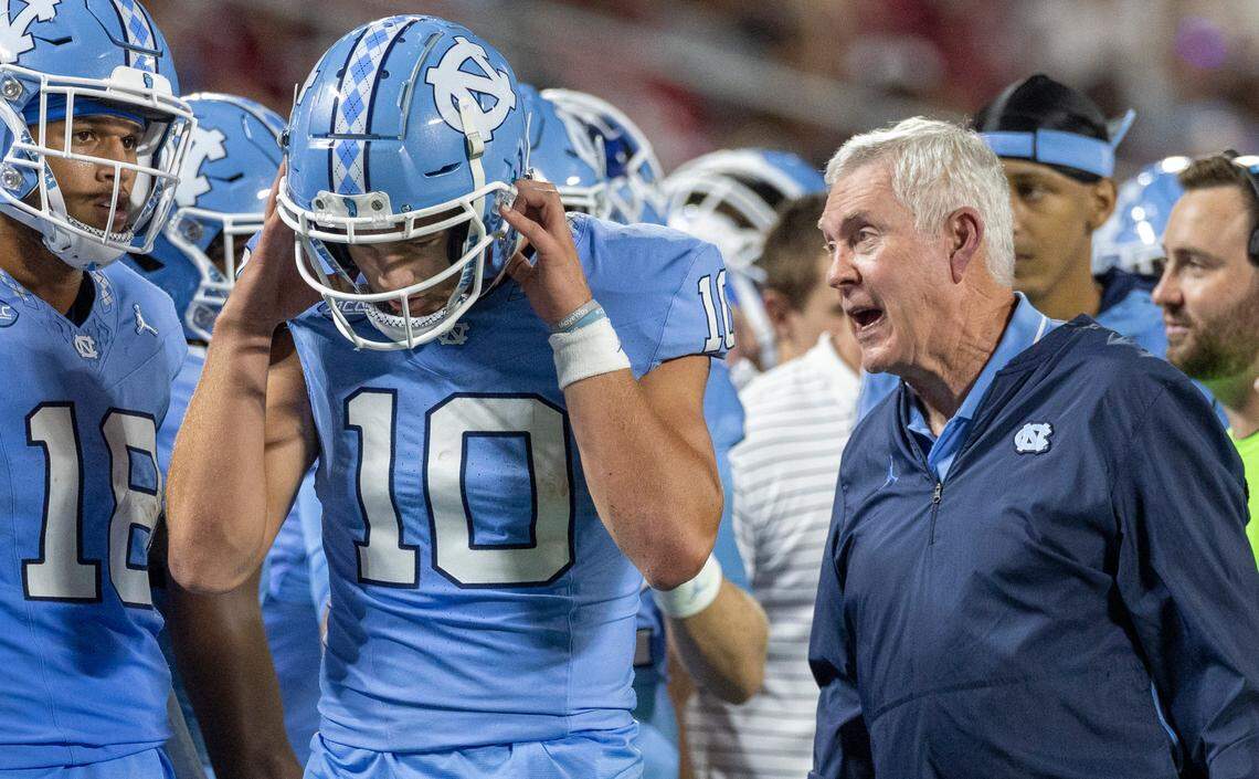 North Carolina coach Mack Brown has a word with quarterback Drake Maye (10) after a touchdown pass to John Copenhaver in the third quarter against South Carolina on Saturday September 2, 2023 at Bank of America Stadium in Charlotte, N.C.