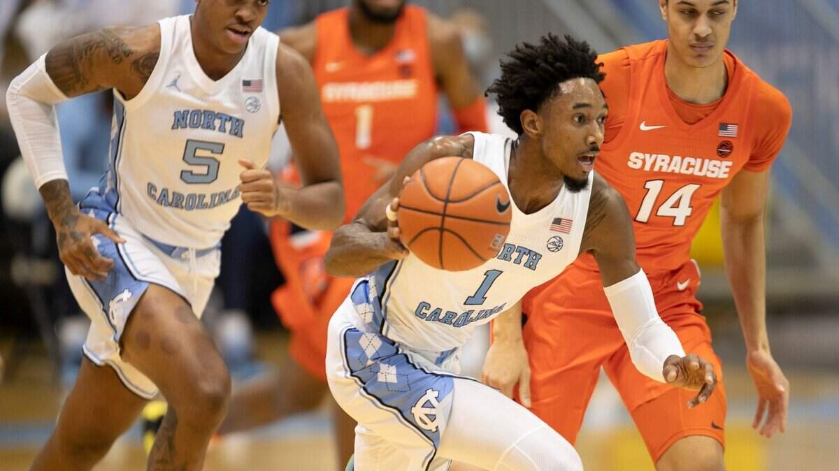 North Carolina’s Leaky Black (1) leads a fast break ahead of Syracuse’s Jesse Edwards (14) during the first half on Tuesday, January 12, 2021 at the Smith Center in Chapel Hill, NC.