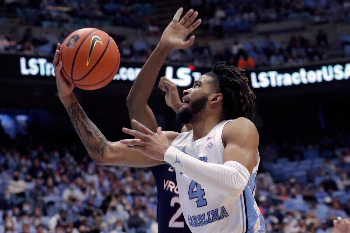 North Carolina guard R.J. Davis (4) drives to the hoop against Virginia during the first half of an NCAA college basketball game Saturday, Jan. 8, 2022, in Chapel Hill, N.C.
