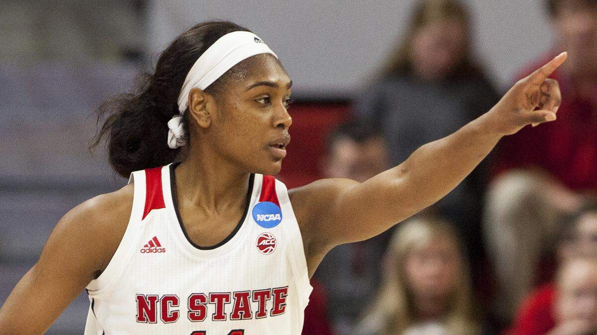 North Carolina State's Kiara Leslie (11) points to a teammate after hitting a 3-pointer during the first half of a first-round game in the NCAA women's college basketball tournament against Elon in Raleigh, N.C., Friday, March 16, 2018.