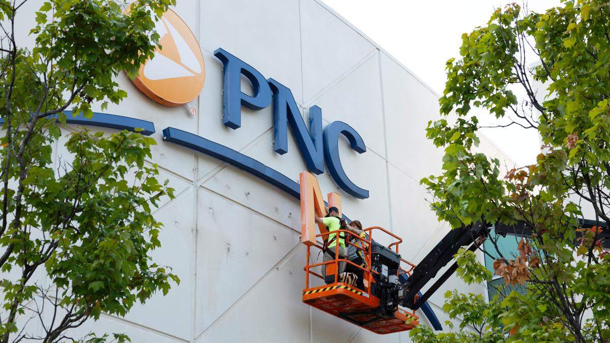 Workers remove PNC Arena signage the arena in Raleigh, Monday, Sept. 9, 2024. As of this date, no new naming rights have been officially announced.