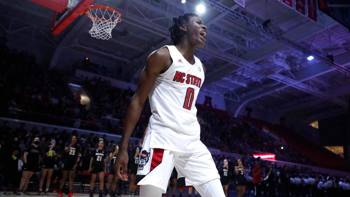N.C. State’s Terquavion Smith (0) celebrates after making a slam during Primetime with the Pack at Reynolds Coliseum in Raleigh, N.C., Thursday, October 14, 2021.