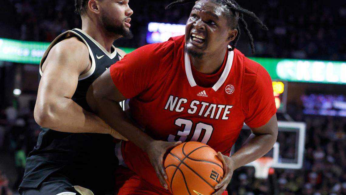 N.C. State’s D.J. Burns Jr. (30) looks to shoot as Wake Forest’s Davion Bradford (20) defends during the first half of N.C. State’s game against Wake Forest at Joel Coliseum in Winston-Salem, N.C., Saturday, Jan. 28, 2023.
