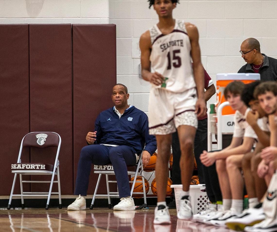 With North Carolina coach Hubert Davis seated close by, Jarin Stevenson grabs a cup of water as he comes out of the game in the second half against Western Alamance on Thursday, December 8, 2022 in Pittsboro, N.C. Davis has already offered Stevenson a scholarship.