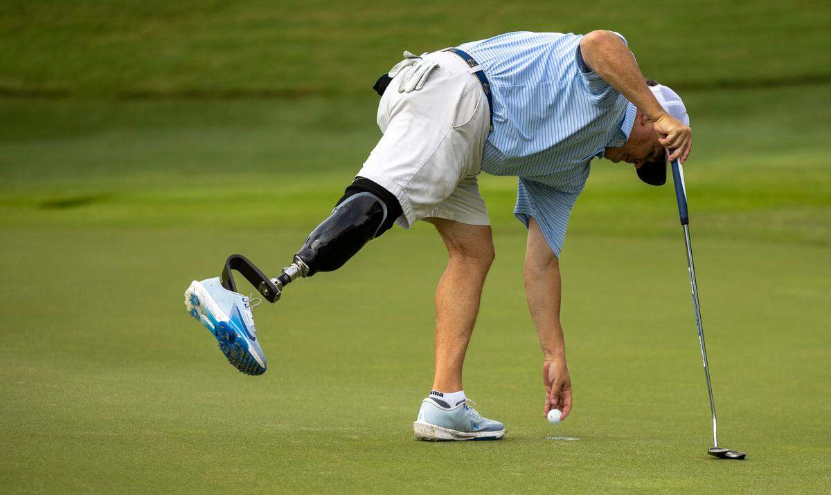 Garrett Smyth, 55, plays a round of golf on Wednesday, July 2, 2025, at Carolina Country Club in Raleigh. Smyth will compete in the U.S. Adaptive Open for the first time this week in Maryland. A four-time bone cancer survivor, he had his right leg amputated below the knee in 2023 and rediscovered his love for competitive golf.