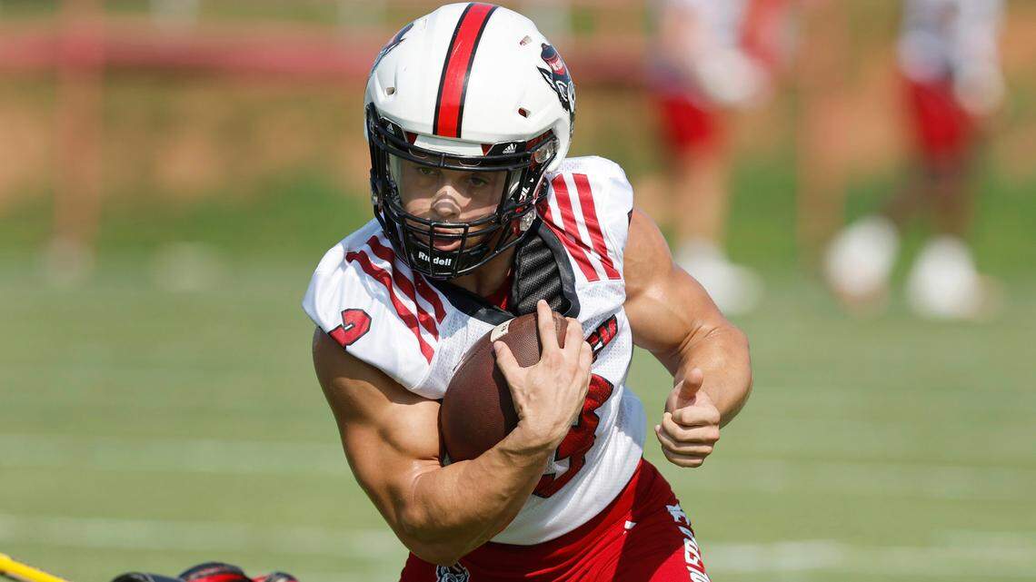 N.C. State running back Jordan Houston (3) runs upfield during a drill during the Wolfpack’s first practice of fall camp in Raleigh, N.C., Wednesday, August 3, 2022.