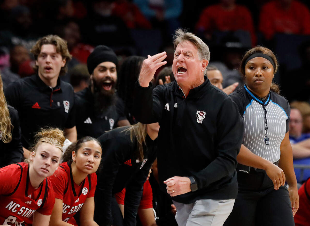 N.C. State head coach Wes Moore gives instructions from the sideline during the first half of the Wolfpack’s game against top-ranked South Carolina on Sunday, Nov. 10, 2024, at Spectrum Center in Charlotte, N.C.