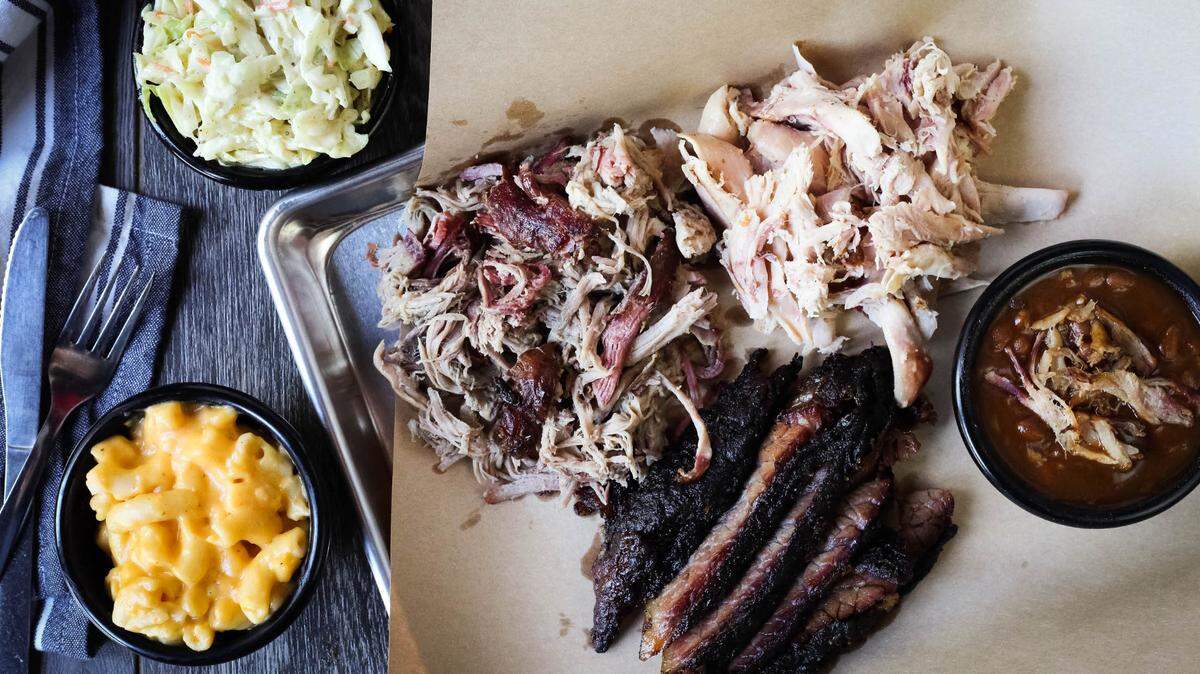 A plate of meats and sides from the barbecue restaurant Red Hot & Blue.