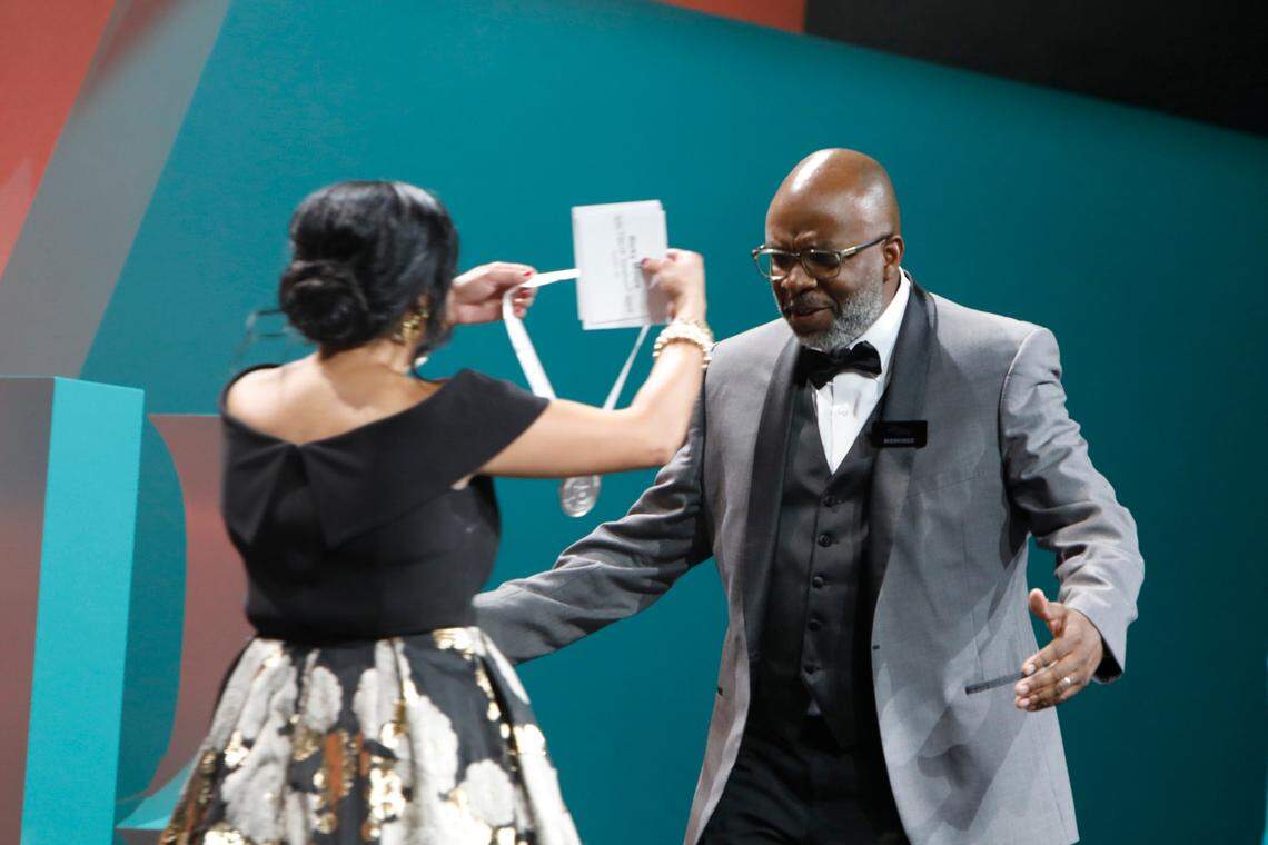 Maneet Chauhan presents Durham, NC chef Ricky Moore of Saltbox Seafood Joint the award for Best Chef: Southeast during the 2022 James Beard Restaurant and Chef Awards at Lyric Opera of Chicago on June 13, 2022 in Chicago, Illinois. 