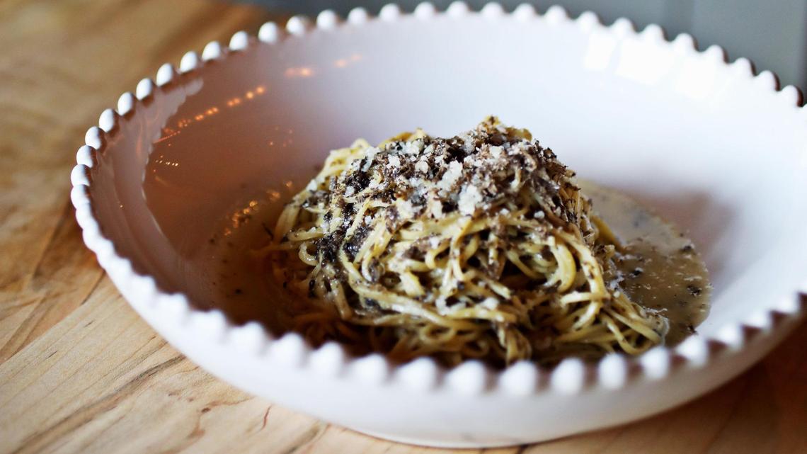 Cucciolo Osteria’s truffle tajarin presents as thin, egg-rich noodles flecked with black truffle.