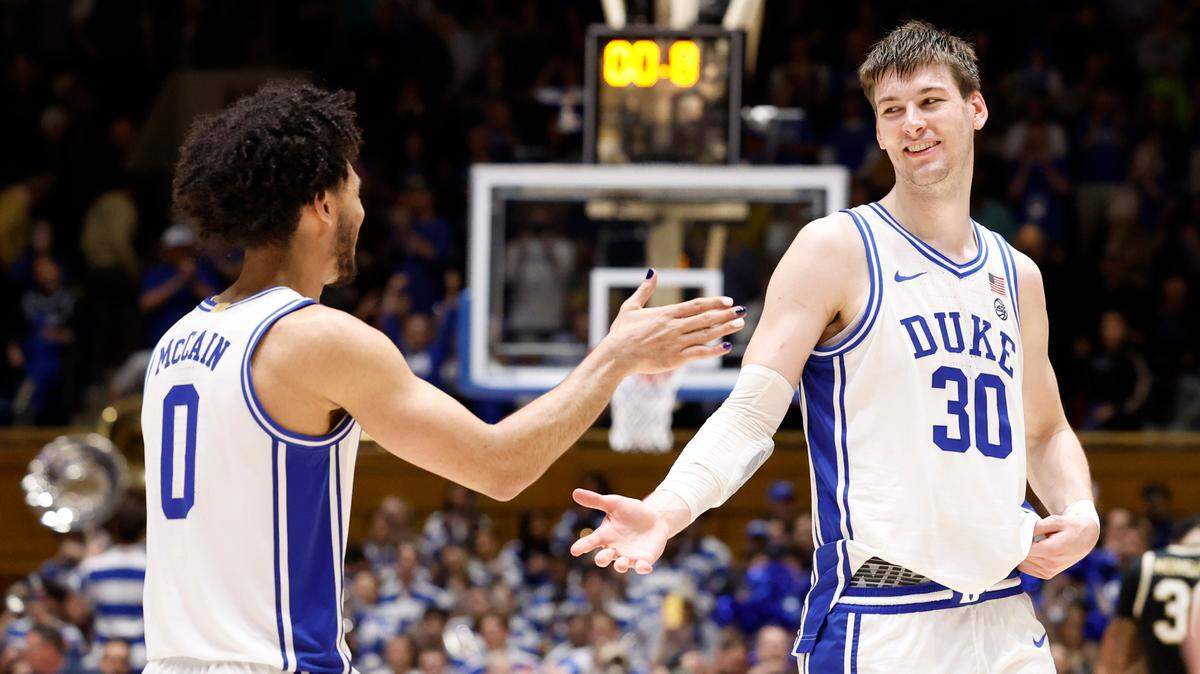 Duke’s Kyle Filipowski (30) celebrates with Jared McCain (0) as time runs out in Duke’s 77-69 victory over Wake Forest at Cameron Indoor Stadium in Durham, N.C., Monday, Feb. 12, 2024.
