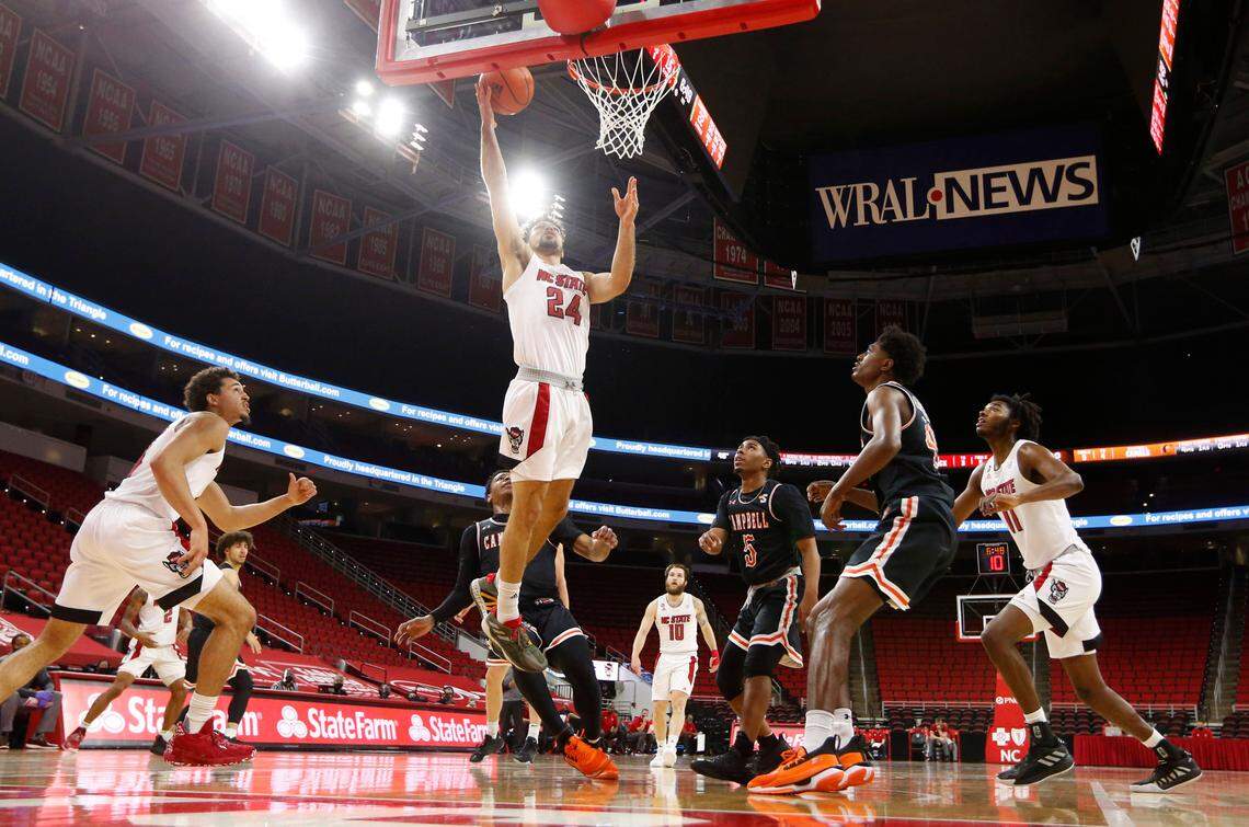 N.C. State’s Devon Daniels (24) puts in two during N.C. State’s 69-50 victory over Campbell at PNC Arena in Raleigh, N.C., Saturday, Dec. 19, 2020.